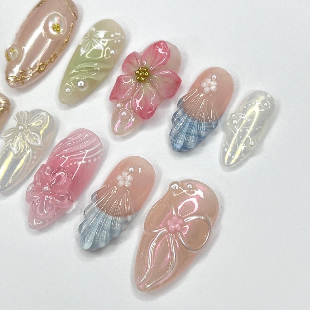 Garden Whisper - Spring Summer Collection Handmade Pastel Floral Press-On Nails – soft pink, green, and pearl tones with 3D flowers, ribbons, and intricate designs. Perfect for birthdays, weddings, vacations, or as a thoughtful gift for her.