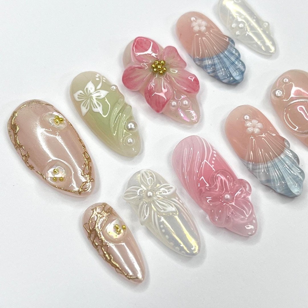 Garden Whisper - Spring Summer Collection Handmade Pastel Floral Press-On Nails – soft pink, green, and pearl tones with 3D flowers, ribbons, and intricate designs. Perfect for birthdays, weddings, vacations, or as a thoughtful gift for her.