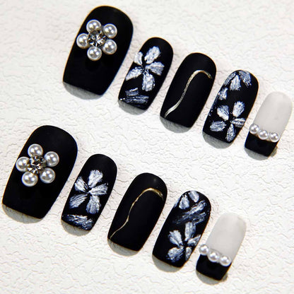 Elegant Black Nails with Pearl Embellishments