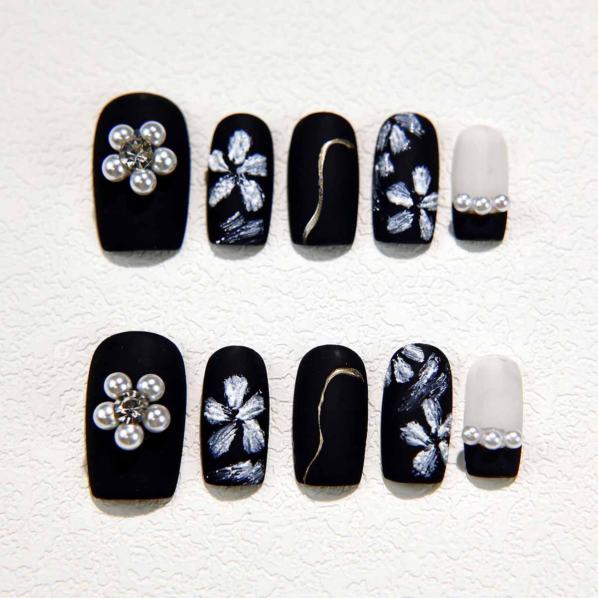 Elegant Black Nails with Pearl Embellishments