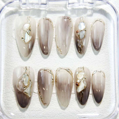 Elegant Marble Nails with Shell Accents