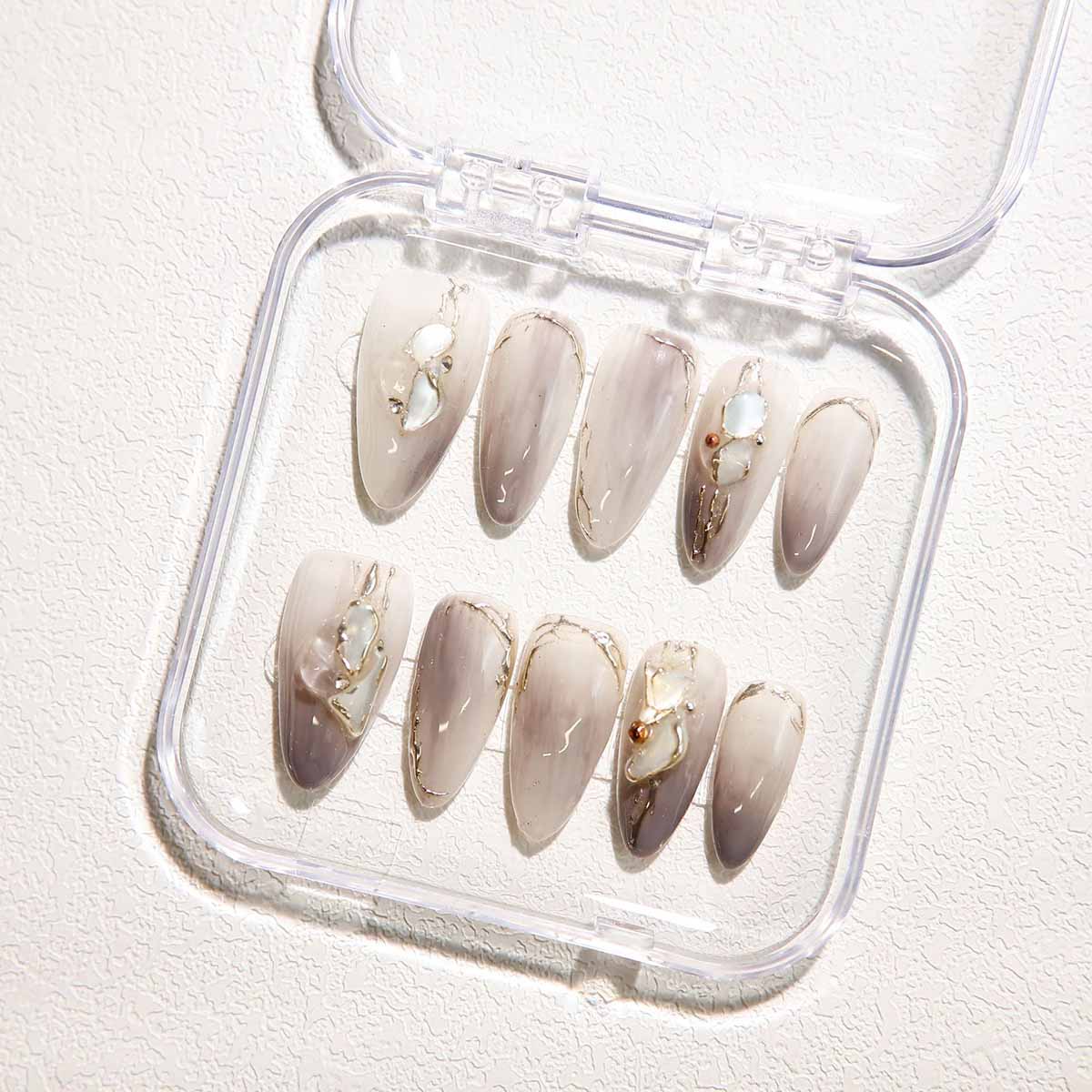 Elegant Marble Nails with Shell Embellishments