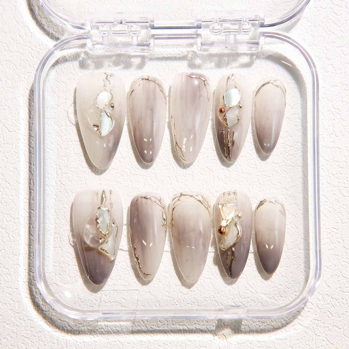 Elegant Marble Nails with Shell Embellishments