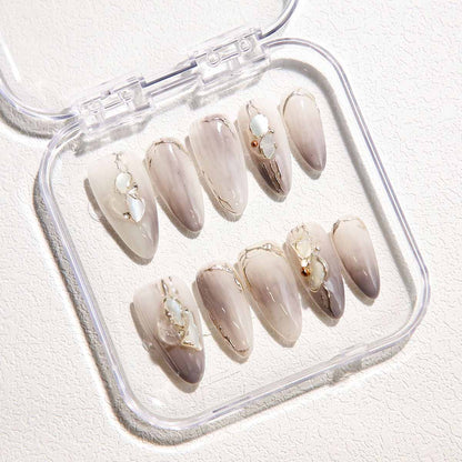 Elegant Marble Nails with Shell Embellishments