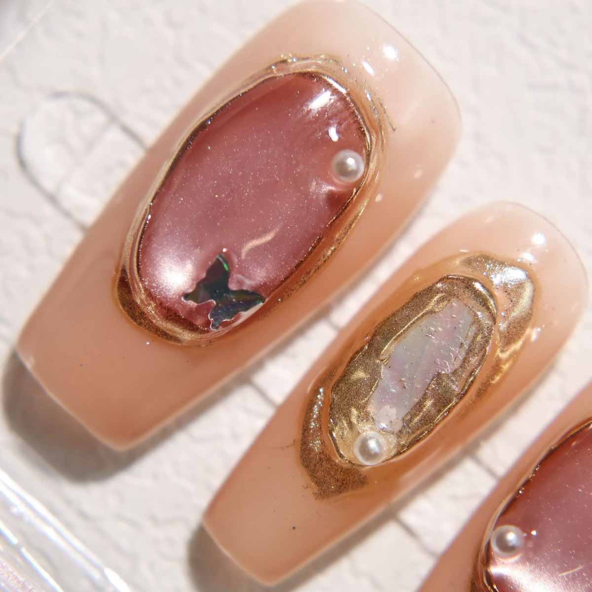 Elegant Nude - toned Nails with Delicate Embellishments