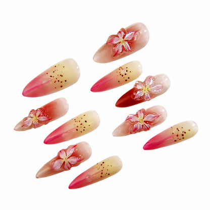 Elegant Ombre Nails with Blossom Embellishments