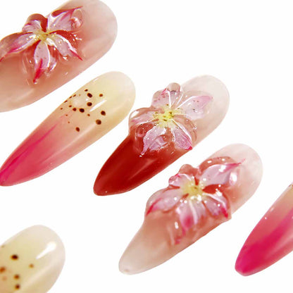 Elegant Ombre Nails with Blossom Embellishments