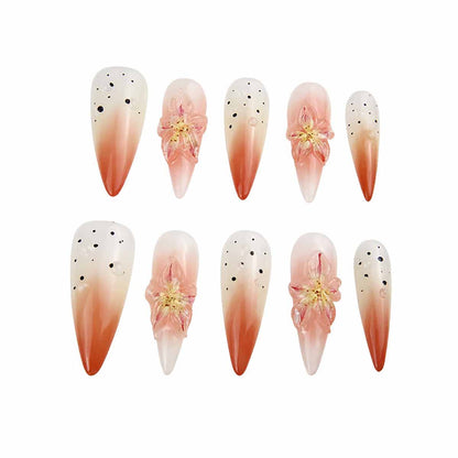 Elegant Ombre Nails with Floral Embellishments