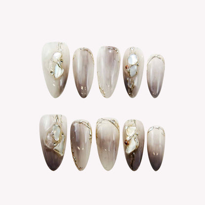 Elegant Marble Nails with Shell Accents