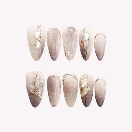 Elegant Marble Nails with Shell Embellishments