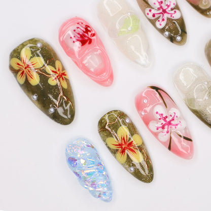 Handmade Tropical Floral Press-On Nails – Spring Collection-  earthy green, soft pink, and translucent tones with 3D flowers, pearl accents, and shimmer. Perfect for vacations, beach days, or as a unique gift for her.