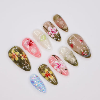 Handmade Tropical Floral Press-On Nails – Spring Collection-  earthy green, soft pink, and translucent tones with 3D flowers, pearl accents, and shimmer. Perfect for vacations, beach days, or as a unique gift for her.