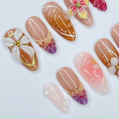 Handmade Floral Press-On Nails – earthy nude and soft pink tones with 3D flowers, gold accents, and plaid patterns. Perfect for weddings, birthdays, holidays, or as a unique gift for her