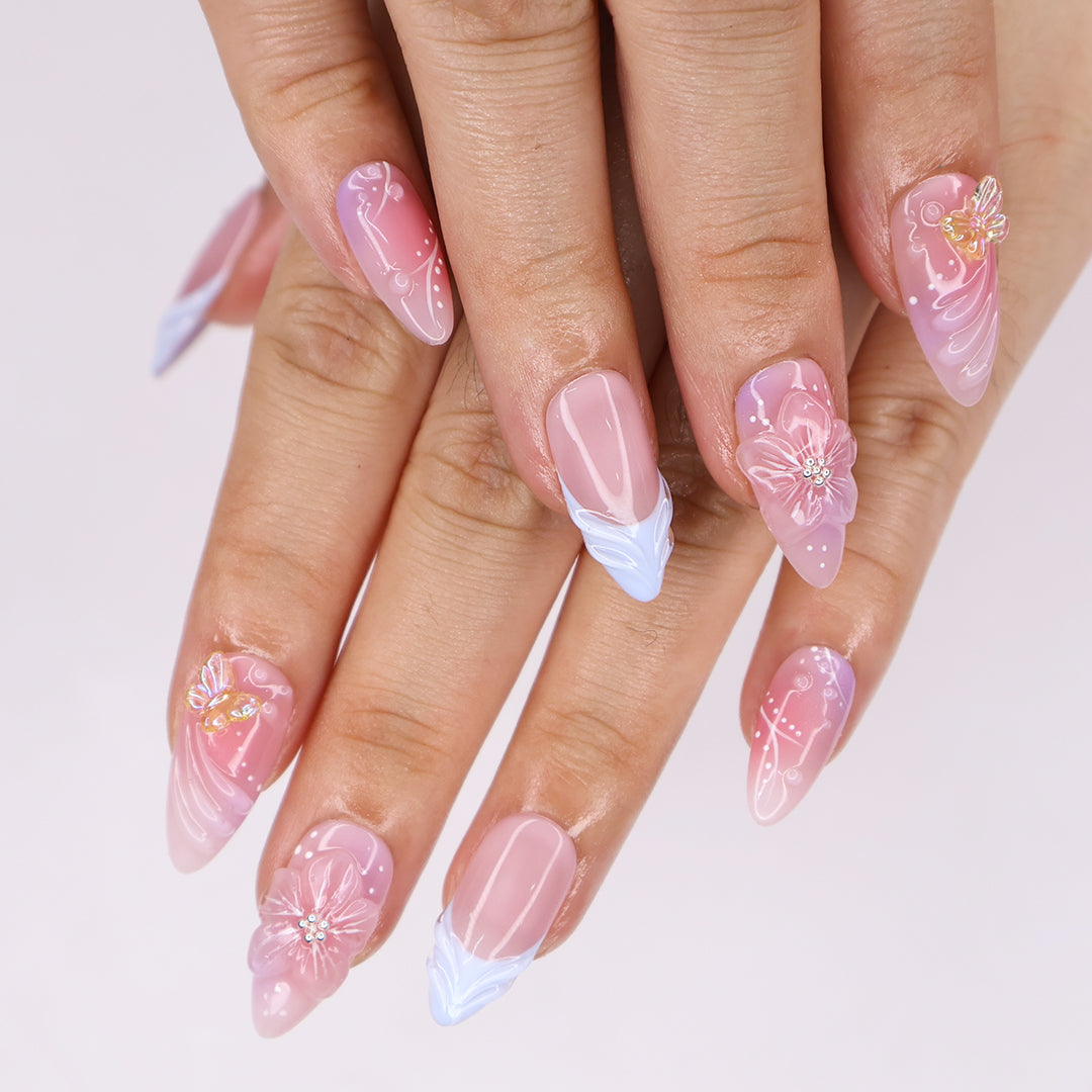 Serenity Garden - Spring Collection - Handmade Butterfly & Flower Press-On Nails – soft pink tones with delicate 3D floral accents, butterflies, and blue French tips. Perfect for birthdays, weddings, vacations, or as a beautiful gift for her.