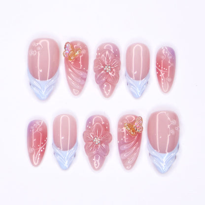 Serenity Garden - Spring Collection - Handmade Butterfly & Flower Press-On Nails – soft pink tones with delicate 3D floral accents, butterflies, and blue French tips. Perfect for birthdays, weddings, vacations, or as a beautiful gift for her.